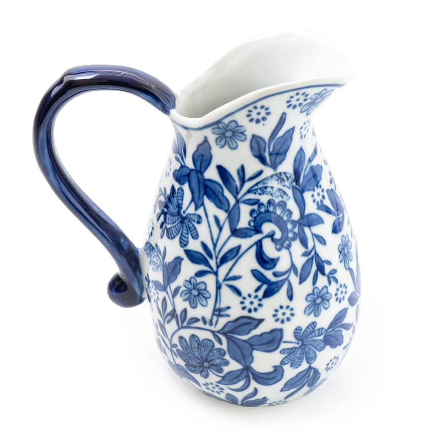 Elegant Oriental blue and white porcelain jug with intricate patterns, ideal for a sophisticated homeware addition or as a classic decorative piece.