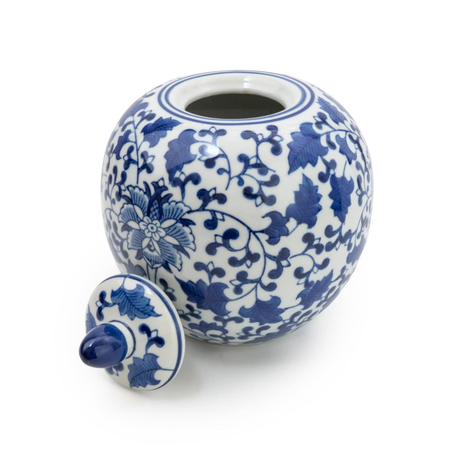 An Oriental Blue & White Round Ginger Jar sits elegantly with intricate traditional patterns, showcasing a glossy finish and a classic, curved silhouette.
