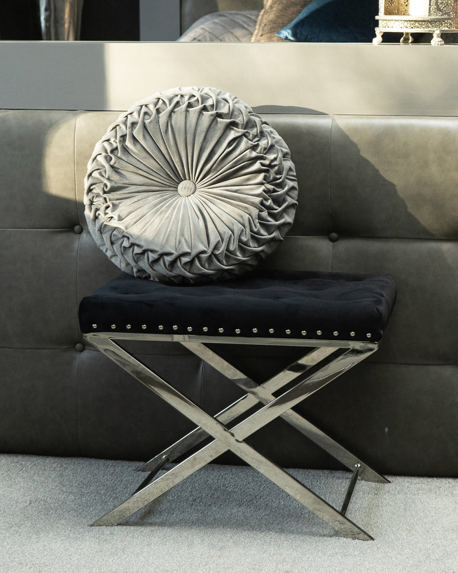 This Rectangular Silver Metal Stool with Black Velour Cushion lends a touch of modern class with its metal frame and black velvet cushion.